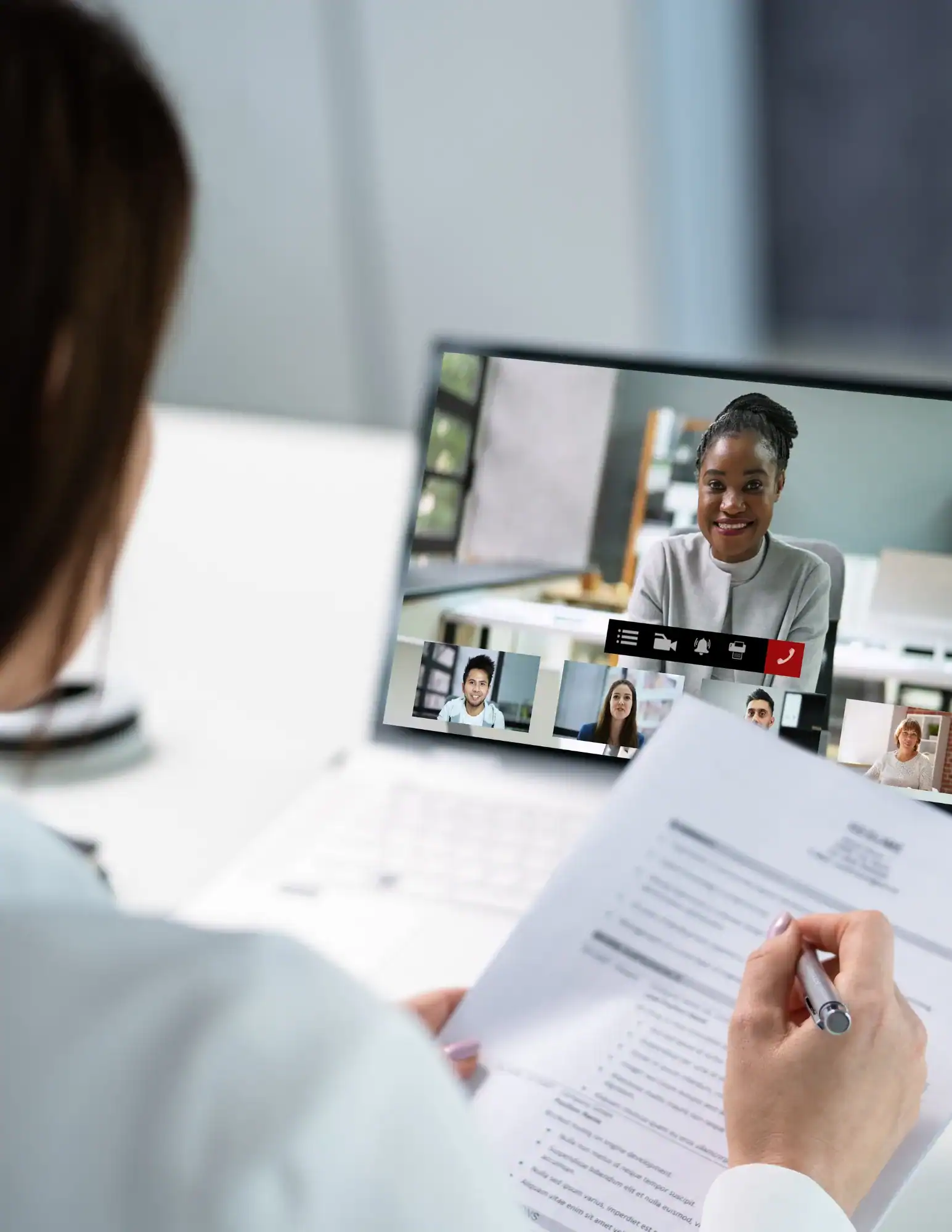 Online interview via Zoom person with resume and candidate on computer screen